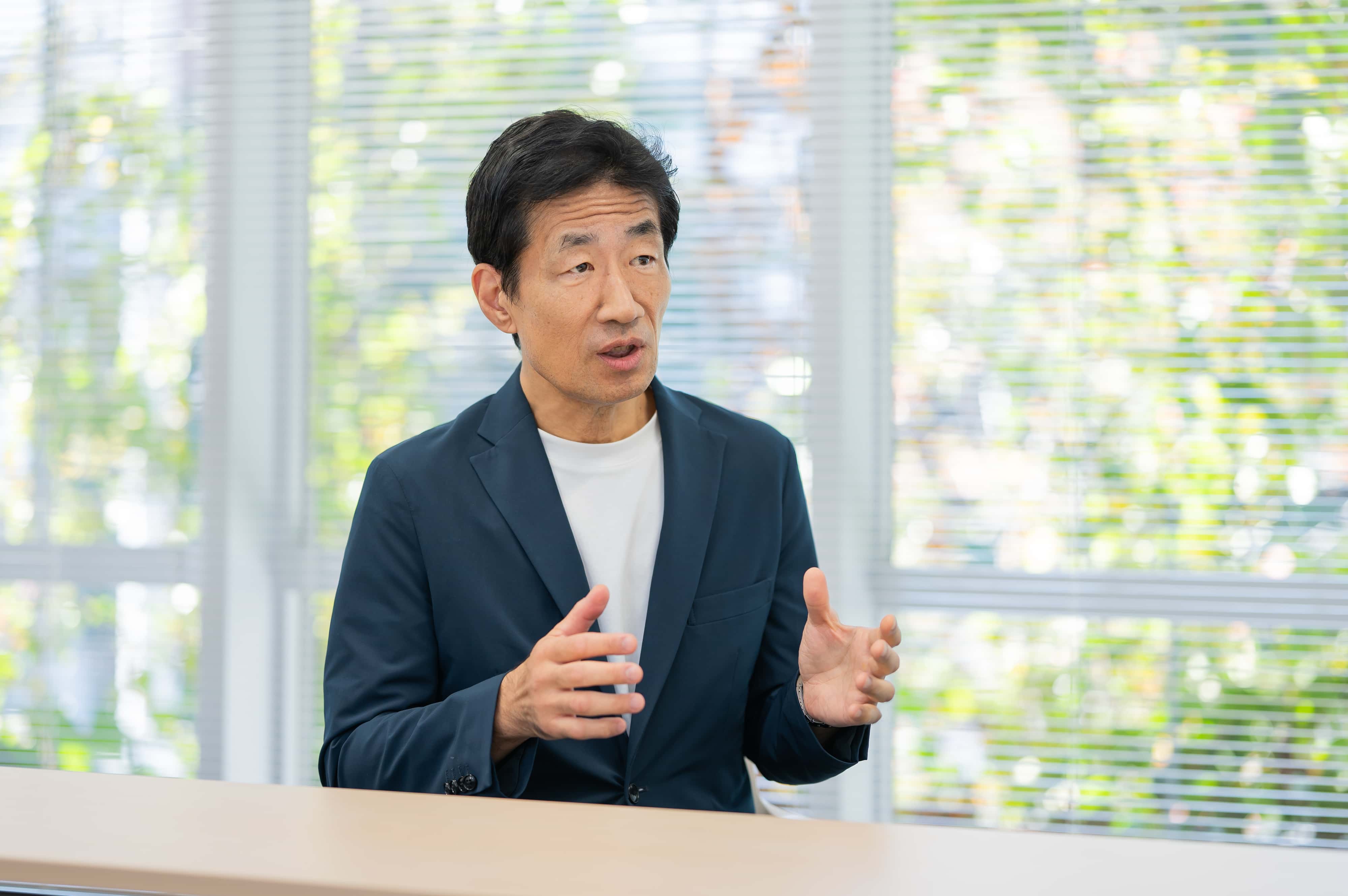 インターネット黎明期の通信技術の変化について話す坂田淳一先生