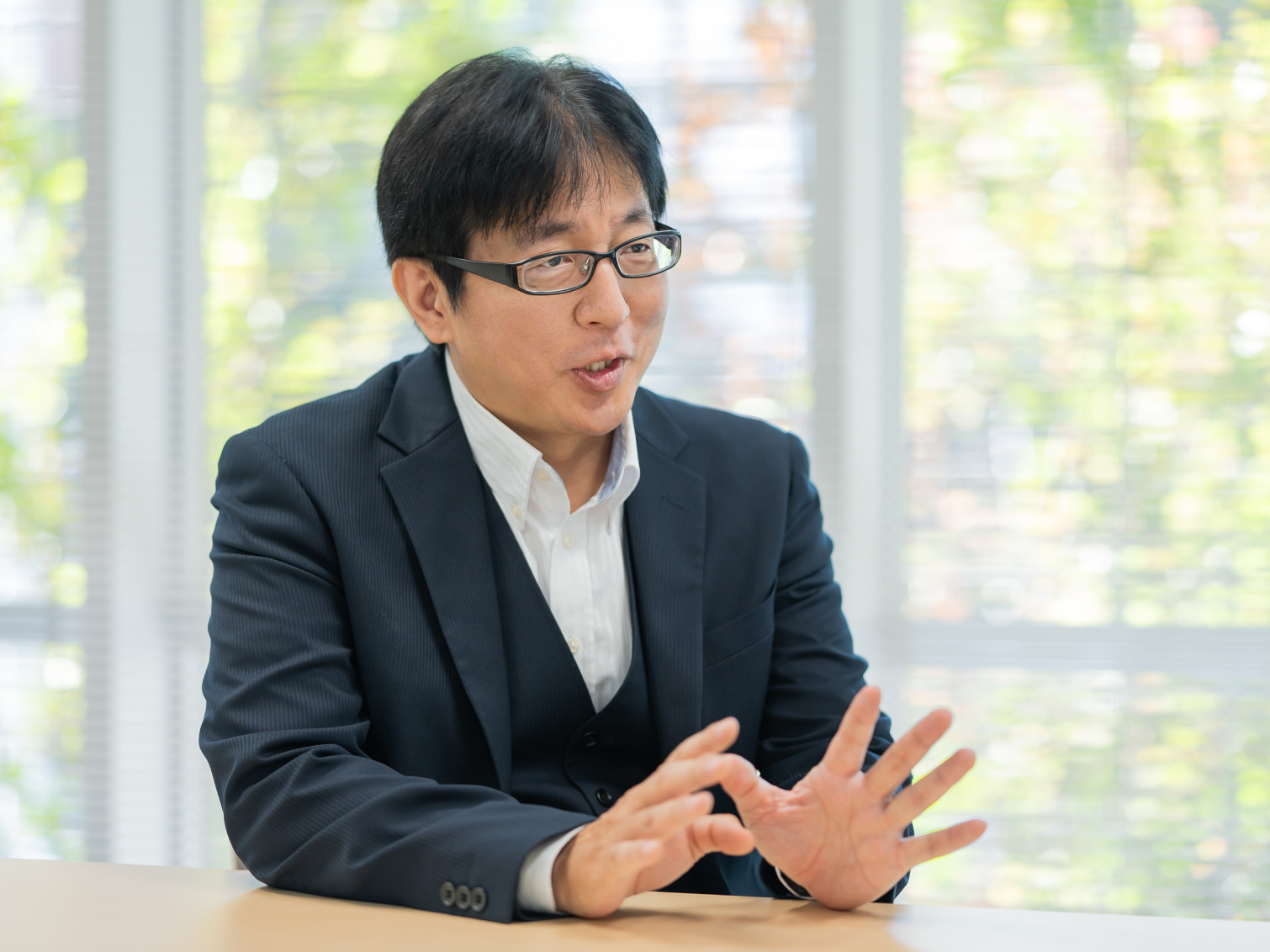 日本語での会話に変革意識を覚えた経験について語る近山和広先生